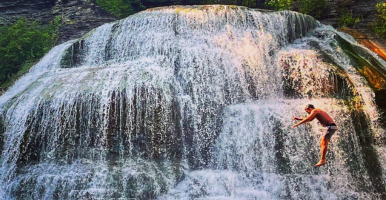 Summer Adventures: Man jumping into water.